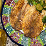 Tilapia con vegetales salteados
